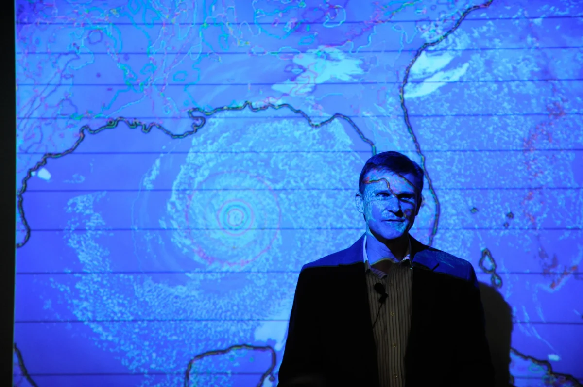 Students listen to a presentation about Hurricane Katrina at the Hunt Library's visualization lab. The visualization lab is often used to showcase publications.