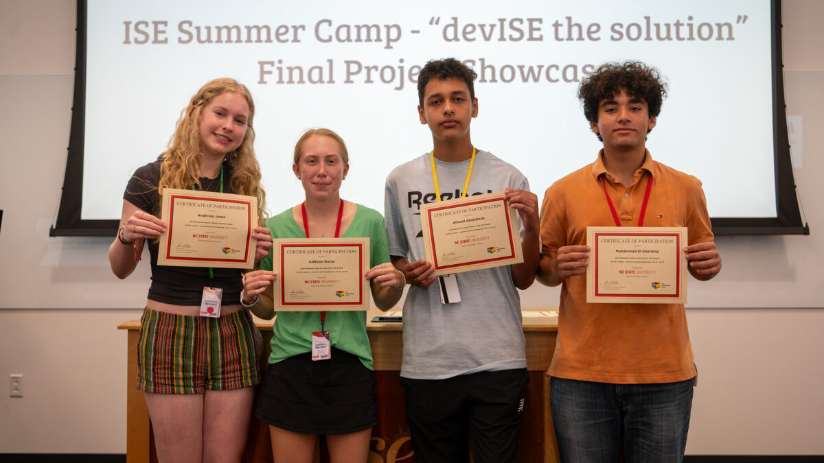 Team Pirate Showdown showing off their summer camp certificates.
