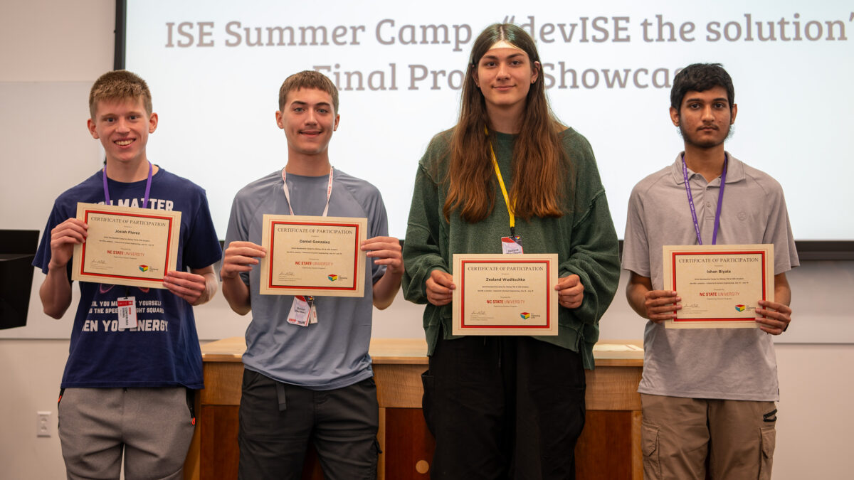 Team ISE Core showing off their summer camp certificates.
