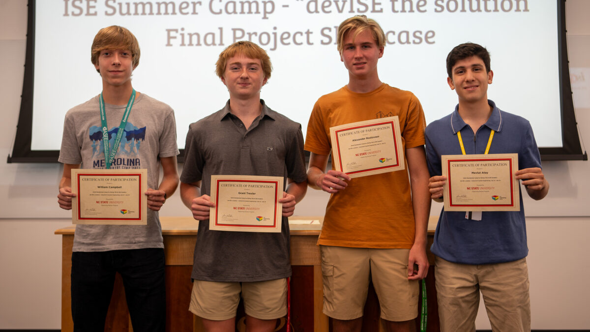 Team Venus Conquest showing off their summer camp certificates.