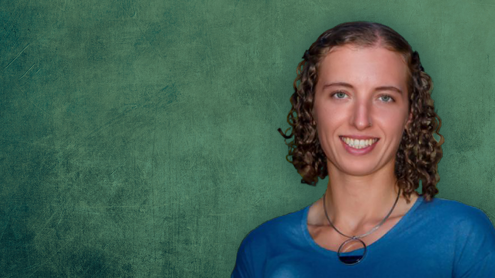 A headshot of Constance Crozier standing Infront of a dark green background.