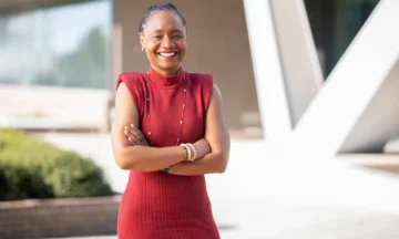 Rashinda Hodge poses outside Fitts Woolard Hall.