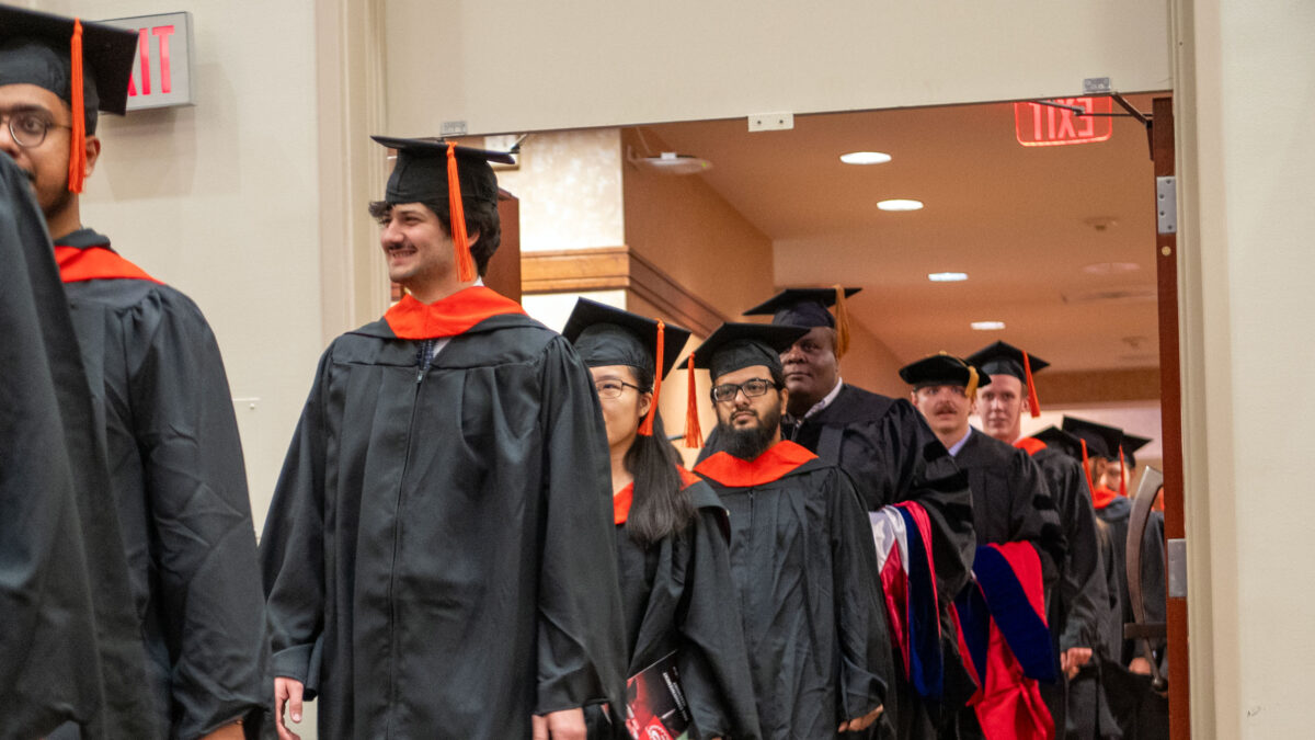 Students walking into the commencement ceremony.