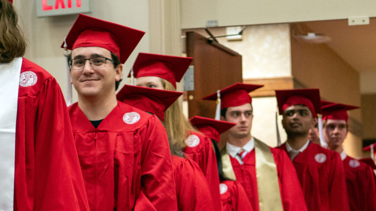 Students walking into the commencement ceremony.