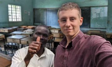 ISE alumnus Lucas Mallison standing with a teacher in the Kenyan school.