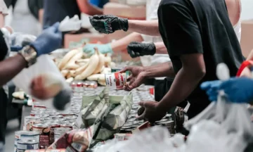 Several volunteers sorting food at a food bank